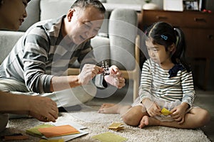 Grandparent playing with niece at home