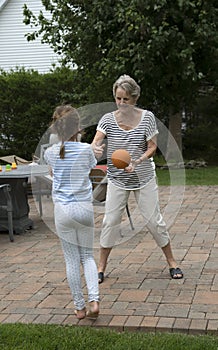 Grandparent playing with young girl