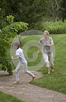 Grandparent playing with young girl