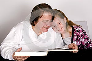 Grandparent is reading to grandchild