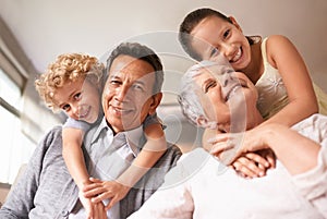 Grandparents are the best. Portrait of grandparents with their two grandkids.