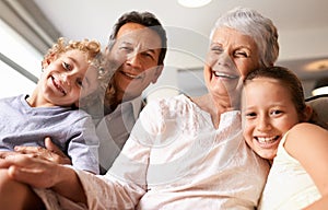 Grandparents are the best. Portrait of grandparents with their grandchildren at home.