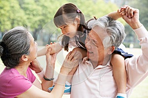 Grandparents Giving Granddaughter Ride