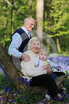 Grandparents with grandchild hiking in the forest