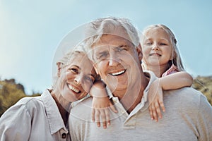 Grandparents, grandchild and portrait in a park for family, love and bonding in nature on blue sky background. Face