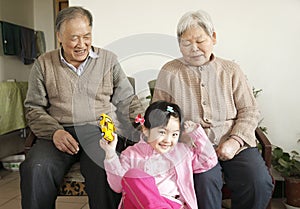 Grandparents with granddaughter photo