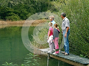 Grandparents and granddaughters on river