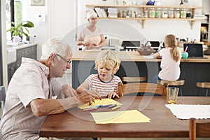 Grandparents and grandkids in family kitchen, close up photo