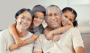 Grandparents, grandkids and hug portrait of family relax, love and care on lounge sofa at home. Smile, play and happy