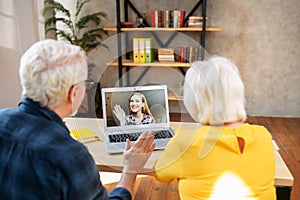 Grandparents have online meeting with a granddaughter