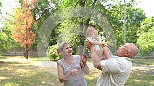 Grandparents having great fun with their grandchild