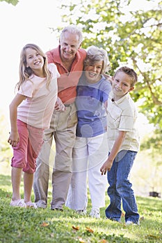 Grandparents laughing with grandchildren