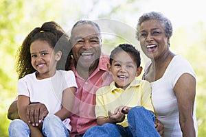 Grandparents laughing with grandchildren photo