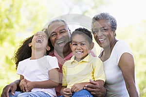 Grandparents laughing with grandchildren