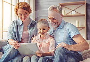 Grandparents and little girl at home