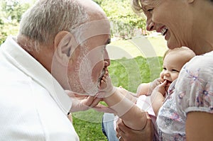 Grandparents Playing With Granddaughter