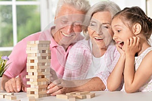 Grandparents playing with her little granddaughter