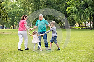 Grandparents Playing With Their Grandchildren