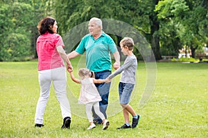 Grandparents Playing With Their Grandchildren