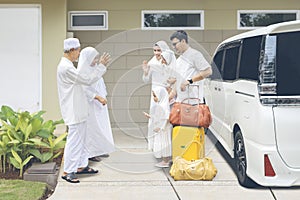 Grandparents saying goodbye to their family