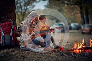 Grandparents singing with grandchildren; Quality family time concept photo