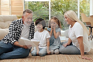 Grandparents spending time with their grandchildren at home