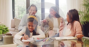 Grandparents talking and watching their little granddaughters draw a picture while babysitting at home. Happy girls