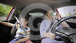 Grandson gets in the way and annoys his grandmother in the car