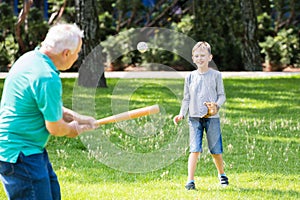 Grandson And Grandfather Playing Baseball