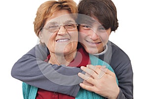 Grandson hugging grandmother photo