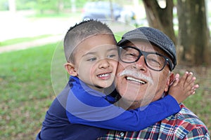 Grandson showing love for grandpa photo