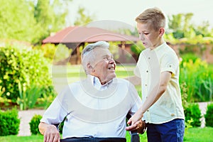 Grandson visiting his old grandfather at nurising home