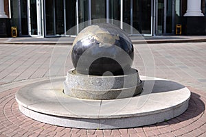 Granite ball mounted on a stand