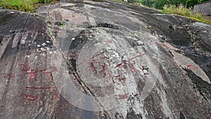 Granite bedrock Aspeberget in Tanumshede with rock paintings in Sweden