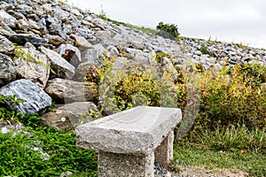 Granite Bench by Rock Wall