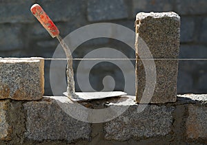 Granite blocks wall construction with mortar