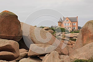 Granite boulder and old villa, Granit Rose coast