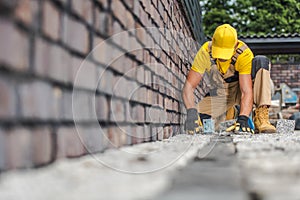 Granite Brick Paving Worker