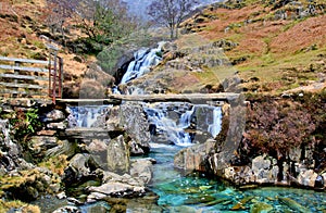 Granite Bridge over Cascading Waterfalls by the Watkins path on the Afon Cwm Llan, Snowdon