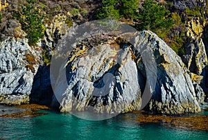 Granite cliffs and calm sea in Point Lobos, Carmel, California