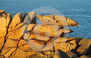 Granite coast rocks at sunset