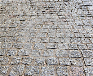 Granite cobblestoned pavement background. photo