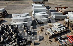granite curbs made of cut granite. smooth stoneware products stacked on a pallet