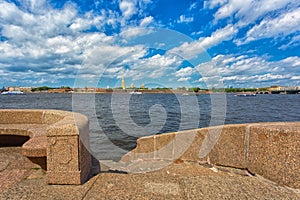 granite embankment of the river Neva and Peter and Paul Fortress at summer day,