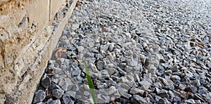 Granite gravel road texture. Natural crushed stone background. Grey  copy space surface with granite, gravel or rock