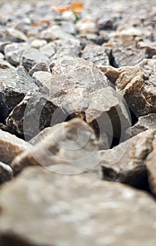 Granite gravel road texture. Natural crushed stone background. Grey  copy space surface with granite, gravel or rock