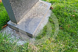 Granite gravestone seen in a rural churchyard in autumn.