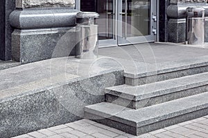 Granite gray porch step with a foot mat at the entrance.