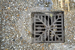 Granite mosaic floor. Construction materials storm drain grate