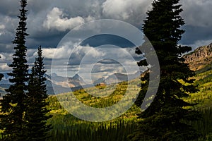 Granite Park Chalet Sits on Sunny Hill on Cloudy Day